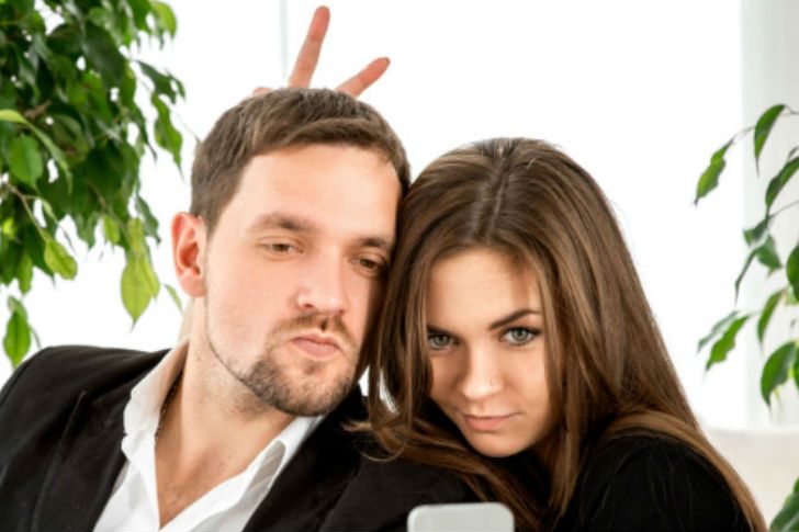 Couple taking a social media selfie