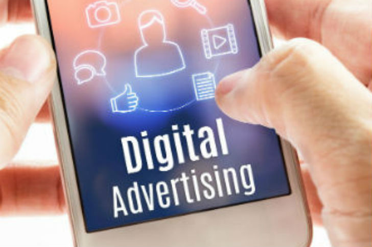 Hand holding digital advertising mobile phone