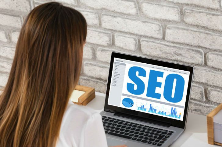 Web design worker working on a laptop