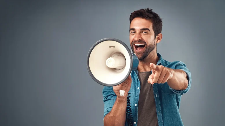 Man shouting call to action with a megaphone.
