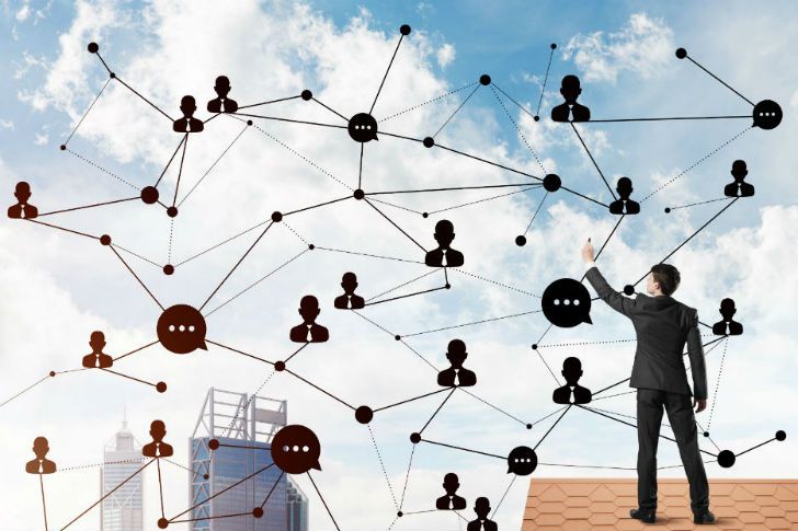 Man drawing social media graphic in sky