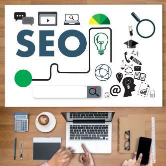 Search engine optimization sign on top of laptop work station