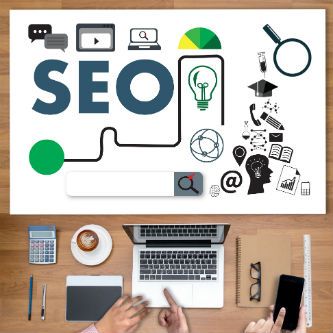 Search engine optimization sign on top of laptop work station