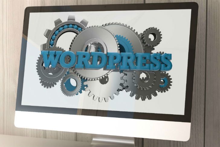 WordPress logo on desktop computer screen