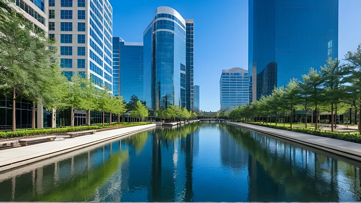Downtown The Woodlands, TX river running through with trees on each side.