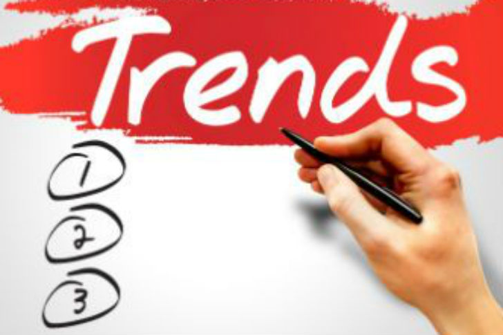 Hand writing web design trends on paper.