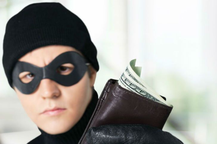 Thief holding your wallet