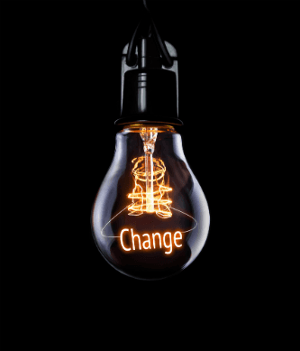 Black background with change written in lightbulb