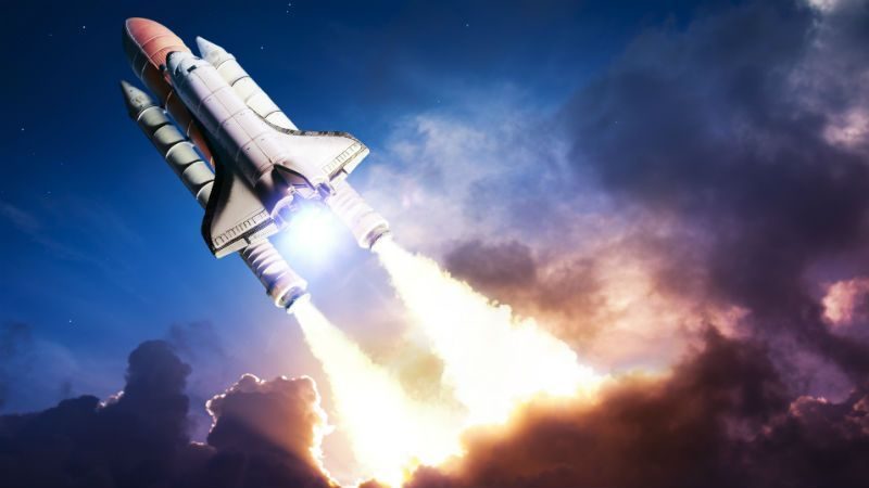 Space shuttle taking off