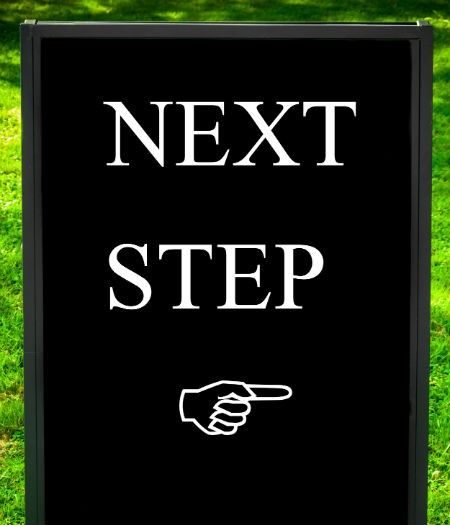 Houston local SEO next step sign with hand pointing to the right