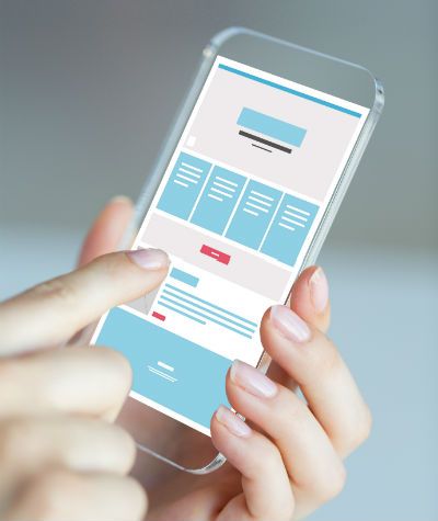 Hand holding mobile optimized web design